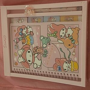 Sanrio, my melody notebook with a pen